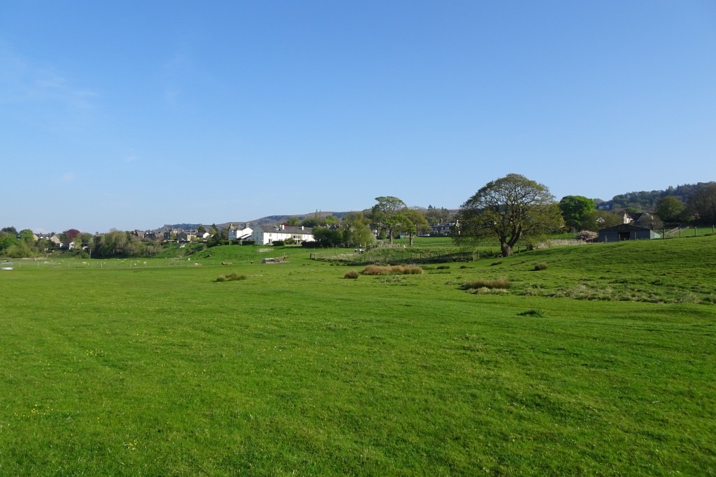 Open green pasture near Hadfield Farm, looking east towards the first houses of Ilkley